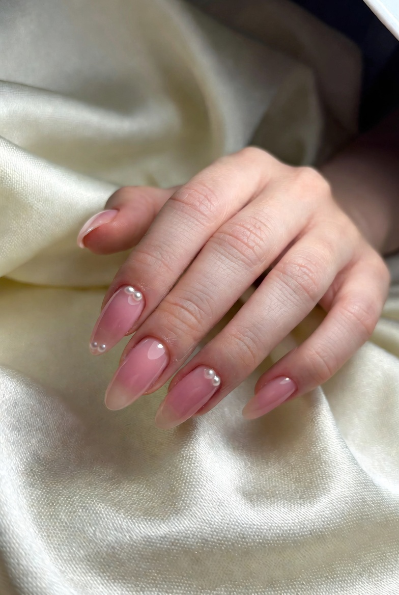 Soft pink gel manicure with pearl detailing