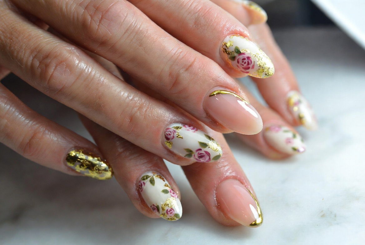 Almond shaped nails with floral hand-painted art